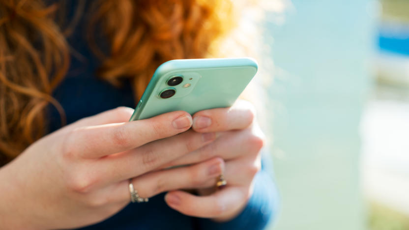Close up or woman using smart phone